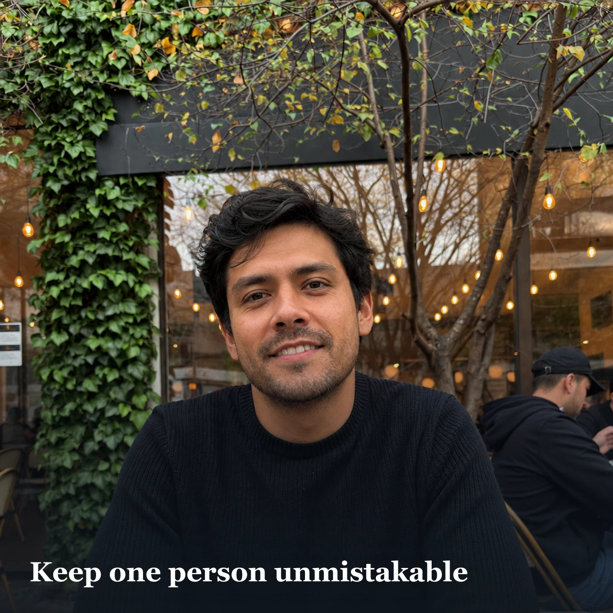 Cafe portrait illustrating social background context while one profile subject remains easy to identify